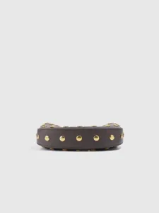 Close-up detail of the dark grey retro studded underarm bag strap and gold metal rivets.