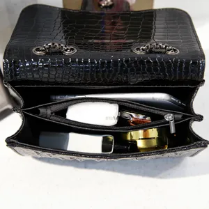 Black crocodile pattern chain shoulder bag interior detail showing spacious multi-compartment capacity