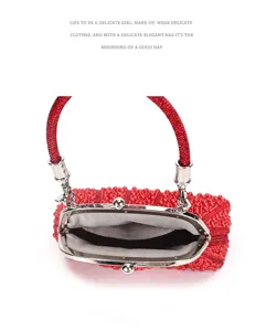 Red beaded evening bag detail, sparkling kiss-lock clutch purse for party and wedding.
