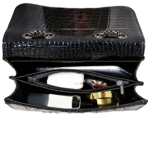 Black crocodile pattern PU leather crossbody chain bag showing interior capacity and compartments.