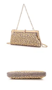 Detailed view of elegant pearl rhinestone evening clutch bag with metal chain strap.