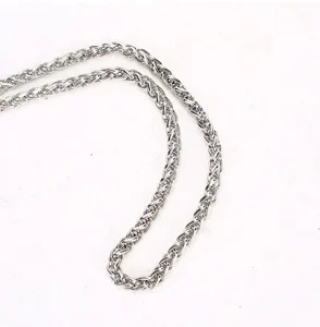 Silver metal chain strap detail, durable accessory for evening bags and shoulder bags.