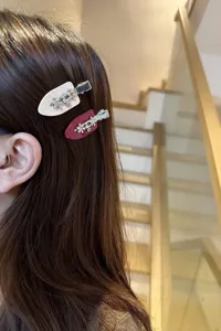 Chic acetate hair clip set featuring sparkling rhinestone small flowers for elegant daily styling.