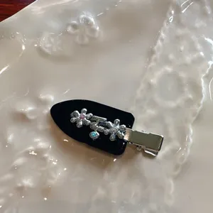 Cute black acetate duckbill hair clip featuring sparkling silver floral rhinestones for women.