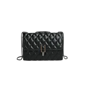 Black quilted leather chain crossbody bag with metal lock closure, elegant shoulder detail.