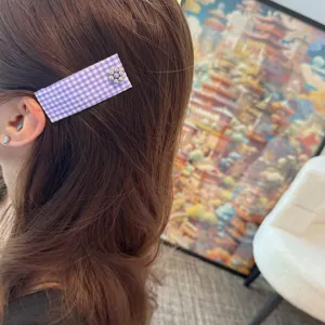 Purple plaid fabric BB hair clip with metal rhinestone flower detail for stylish side hair styling.