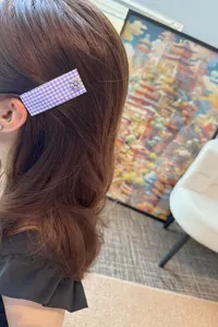 Purple gingham fabric hair clip with cute metal flower, stylish side bangs hairpin accessory.