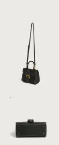 Chic black leather women top handle handbag with metal horseshoe buckle and strap.