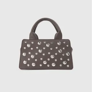 Trendy punk style studded handbag for women, chic commuting shoulder and crossbody bag.