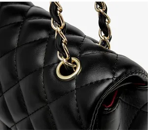 Black quilted leather handbag detail, gold chain strap, luxury flap bag design, chic crossbody style