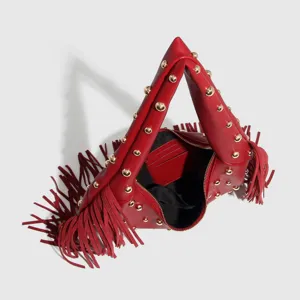 Red leather fringe shoulder bag featuring gold metal studs and unique triangular design.