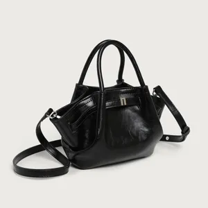 Black pleated bucket bag for women, stylish leather shoulder handbag with top handles.