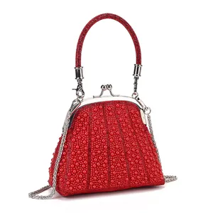 Elegant red beaded clasp evening bag with metallic chain strap for parties and daily wear.