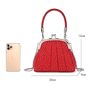 Elegant rhinestone pearl kiss-lock evening bag with chain strap for party and wedding events.