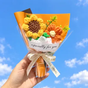 Close-up detail of hand-knitted crochet sunflower bouquet gift wrapping and ribbon.