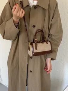 Retro color-block Boston handbag for women, stylish shoulder and crossbody bag with chic hardware.