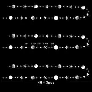 Detailed view of the 4M glitter star and circle paper garland for party decorations.