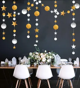 Detailed view of hanging star and circle paper garlands, perfect for party and event decor.