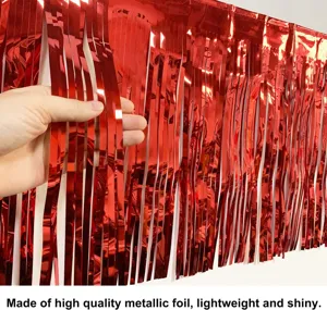 Close up detail of red foil fringe curtain showing shiny metallic tinsel for party decor.