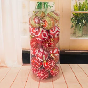 Close-up view of a transparent barrel filled with 24 painted red and gold Christmas baubles.