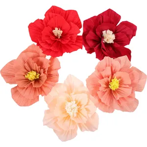 Colorful crepe paper flowers set, handmade artificial floral wedding party decor details.