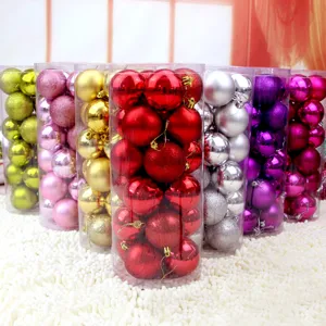 Detailed close-up of colorful Christmas bauble ornaments in clear plastic tubes for holiday decor.