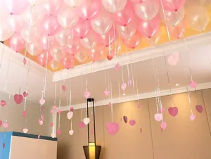 Balloon and heart pendant set for wedding room decoration and birthday party setup.