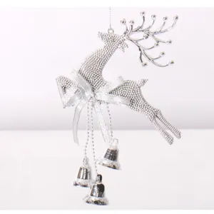 Silver plastic Christmas reindeer ornament with bells, hanging deer decoration for tree.