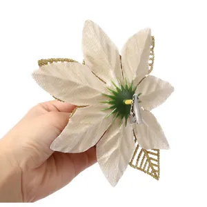 Detail view of a 14cm artificial Christmas poinsettia flower with secure back clip for tree.