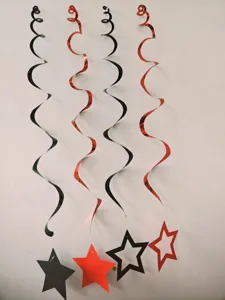 Detailed view of black and red spiral hanging decorations with star pendants for parties.
