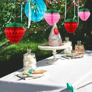 Strawberry paper honeycomb ball party hanging decorations for birthday and holiday celebrations.