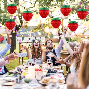 Strawberry honeycomb paper balls hanging decorations for birthday party and wedding decor.