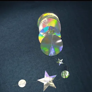 Holographic party hanging decoration with laser rainbow stars and circles for Christmas holiday events.