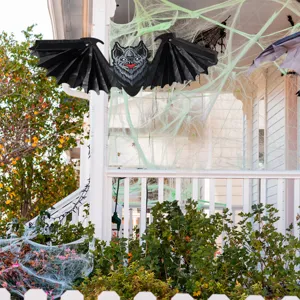 Halloween 3D honeycomb paper bat hanging decoration for spooky porch party and holiday display.