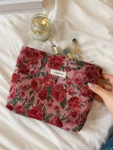 Retro dark red floral jacquard cosmetic bag detail, vintage makeup storage pouch with zipper.