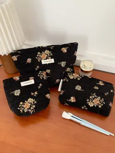 Vintage floral cosmetic bag set, large capacity makeup pouch with elegant woven design.
