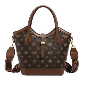 Vintage brown monogram bucket bag with top handle and crossbody strap for women fashion.