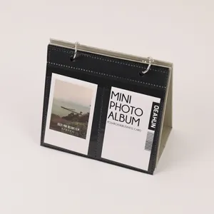 Desktop mini photo album calendar style holder for 3 inch instant films and business cards.