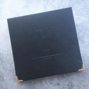 Black leather ticket collection album with metal corners for organizing concert and movie tickets.