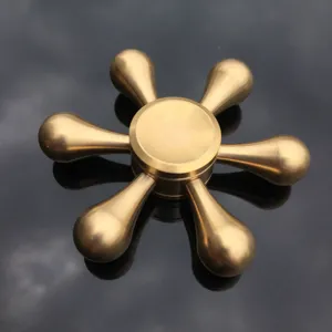 Detailed close-up shot of the six-bladed solid brass hand fidget spinner toy mechanism.