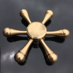 Pure brass 6-arm fidget spinner detail view, high quality metallic stress relief toy.