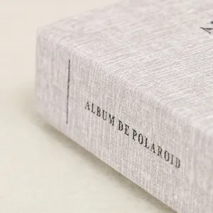 Close-up detail of the textured photo album box cover, showing fine craftsmanship.