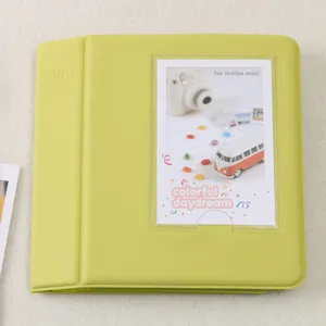 Mini photo album for instax polaroid pictures, candy color leather cover, detail shot.