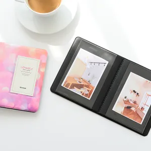 Detailed view of the 3 inch mini polaroid photo album with colorful gradient cover insert.