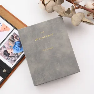 Detailed view of gray velvet mini photo album with gold foil text and photocard storage.