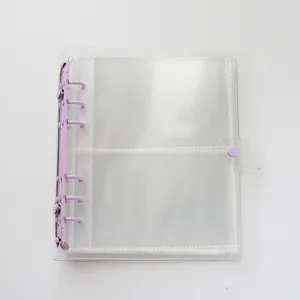 Transparent 6-ring binder cover detail shot with purple metal rings and snap button closure.