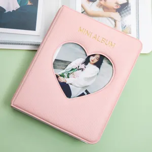 Mini album photo rose avec découpe en cœur, joli porte-cartes Polaroid 3 pouces et livre.