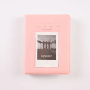 Pink mini photo album cover detail with transparent pocket and gold stamped quote design.