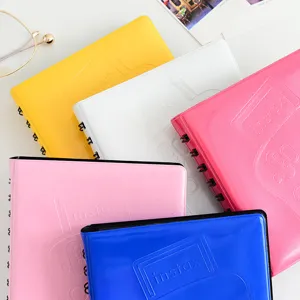 Macaron color mini photo album for 3-inch Instax instant films with coil binding and 68 pockets.