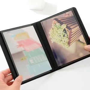 Mini 3-inch photo album black portable card holder for polaroid pictures and tickets.